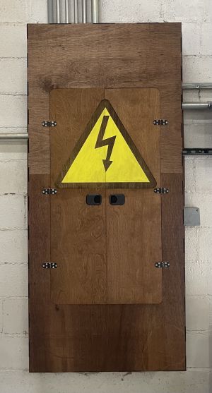 Electrical panel with wood cover